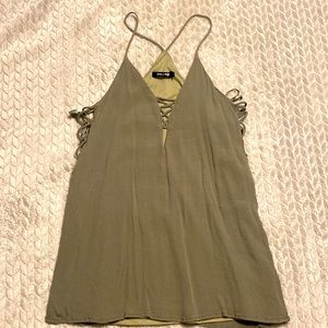 Olive green racerback tank with cutouts on sides.